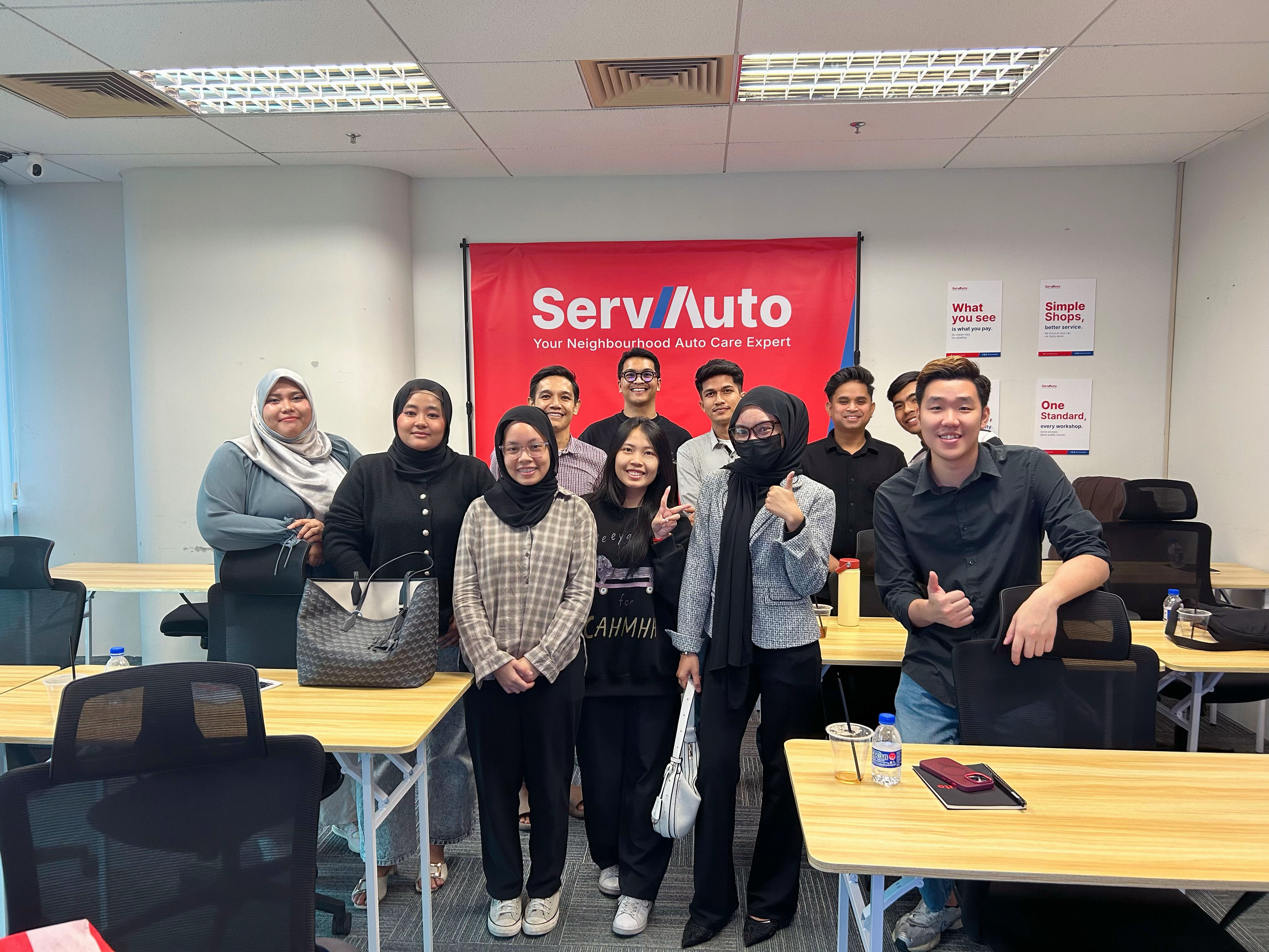 ServAuto past training batch — diverse graduates